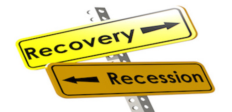 Recovery and recession with yellow road sign